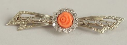 A GOLD, CORAL AND DIAMOND BAR BROOCH.