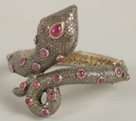 A SUPERB DIAMOND AND RUBY SNAKE BRACELET.