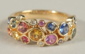 AN 18CT YELLOW GOLD, MULTI SAPPHIRE AND DIAMOND HALF HOOP RING.