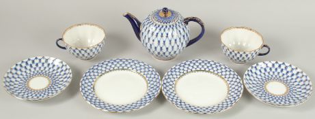 A RUSSIAN ST. PETERSBURG TEA SET, blue and gilt, comprising: tea pot and cover, two cups and saucers