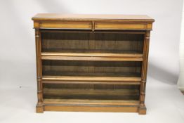 A GOOD VICTORIAN OAK AND EBONY INLAID OPEN BOOKCASE, with a pair of frieze drawers over two shelves,