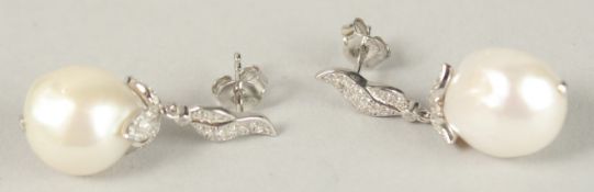 A PAIR OF BAROQUE PEARL DROP EARRINGS.