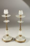 A PAIR OF CUT GLASS AND ORMOLU CANDLESTICKS. 30cms high.