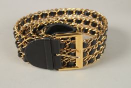 A GOOD CHANEL BLACK LEATHER AND GILT METAL BELT. 62cms long, in a Chanel box.