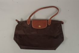 A LONGCHAMP FOLDING BAG.