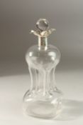 AN EDWARDIAN SILVER MOUNTED DECANTER AND STOPPER. Birmingham 1912. 23cms high.