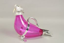 A VERY GOOD RUBY GLASS AND PLATE NOVELTY WALRUS CLARET JUG with carrying handle, on paw feet.
