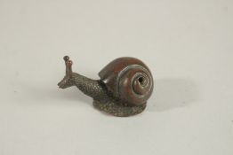 A BRONZE OKIMONO OF A SNAIL.