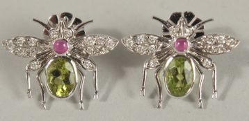 A PAIR OF 18CT WHITE GOLD LARGE FLY DESIGN EARRINGS set with oval peridot, cabochon ruby and