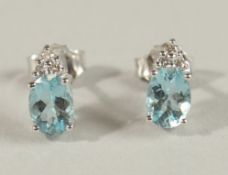 A GOOD PAIR OF 18CT WHITE GOLD, AQUAMARINE AND DIAMOND EAR STUDS.