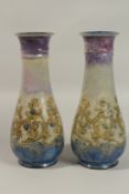 A PAIR OF ROYAL DOULTON STONEWARE VASES by ELIZA SIMMANCE, 30cms high, and A JUG, 20cms high (2).