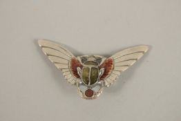 A SILVER SCARAB BROOCH.