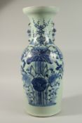 A LARGE CHINESE PALE CELADON BLUE AND WHITE PORCELAIN VASE, painted with a spray of flora, the