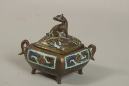 A CHINESE ENAMELLED BRASS TWIN HANDLE CENSER AND COVER, with zoomorphic finial and raised on four