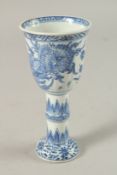A CHINESE KANGXI PERIOD BLUE AND WHITE PORCELAIN STEM CUP, finely painted with native flora, 15.