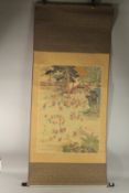 A FINE CHINESE SCROLL PAINTING ON SILK DEPICTING MULTIPLE BOYS PLAYING IN A GARDEN, inscribed
