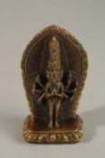 A TIBETAN BRONZE DEITY, 12.5cm high.