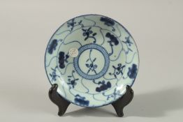 A CHINESE BLUE AND WHITE PORCELAIN DISH, with decorative motifs, mark to base, together with