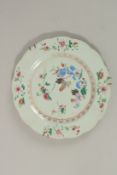 A CHINESE FAMILLE ROSE PORCELAIN PLATE, painted with chickens and flora, 23cm diameter, (af).