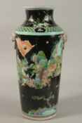 A CHINESE FAMILLE NOIR PORCELAIN WARRIOR VASE, 39.5cm high.