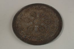A VERY FINE 19TH CENTURY INDIAN SILVER AND GOLD INLAID KOFTGARI STEEL DISH, 25.5cm diameter.
