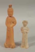 TWO CHINESE POTTERY FIGURES, 26.5cm and 18cm high.