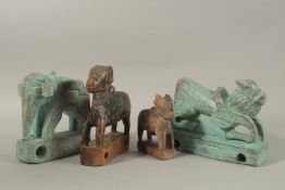 FOUR INDIAN CARVED WOOD ANIMAL TOYS OR FITTINGS - possibly from a temple, (4).