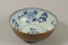 A CHINESE NANKING CARGO BLUE AND WHITE / CAFE AU LAIT PORCELAIN BOWL, the interior painted with