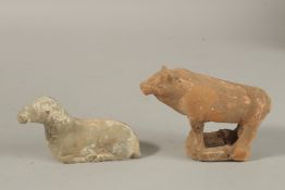 TWO CHINESE POTTERY ANIMAL TOMB FIGURES, POSSIBLY TANG DYNASTY.