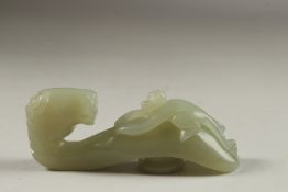 A FINE CHINESE CARVED JADE HORSE AND MONKEY BELT HOOK, 9cm long.