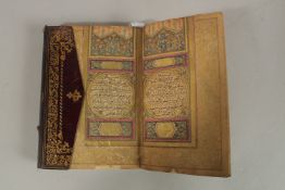 A FINE 18TH CENTURY OTTOMAN LEATHER BOUND GILT ILLUMINATED QURAN.