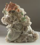 A VERY LARGE AND FINE EARLY 20TH CENTURY CHINESE CARVED JADEITE FLORAL GROUP, with mice and
