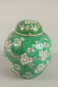A 19TH CENTURY CHINESE FAMILLE VERTE PORCELAIN GINGER JAR AND COVER, the base with character mark,