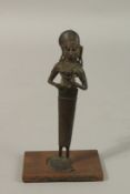A 17TH CENTURY SOUTH INDIAN NAIVE BRONZE FIGURE OF MOTHER AND CHILD, 17cm high.