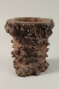 A FINE AND LARGE CHINESE ROOT WOOD BITONG BRUSH POT, of naturalistic form, 19.5cm high.