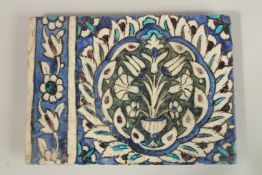 A FINE LARGE 17TH CENTURY OTTOMAN DAMASCUS GLAZED POTTERY TILE, with central floral panel, 27.5cm
