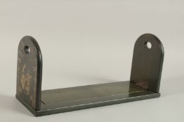 A CHINESE LACQUERED AND GILDED BOOK STAND.