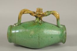 A RARE 19TH CENTURY POSSIBLY OTTOMAN TURKISH CANAKKALE GLAZED POTTERY BARREL SHAPED FLASK, 24cm