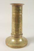 A FINE 19TH CENTURY PERSIAN BRASS CANDLESTICK WITH SILVER INLAYS, the body engraved with seated