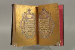 AN 18TH-19TH CENTURY OTTOMAN TURKISH LEATHER BOUND ILLUMINATED QURAN, signed Mustafa Helmi Ibn Hamad