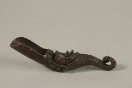 A BRONZE DRAGON HANDLE SPOON.
