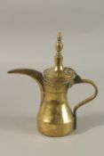 A MIDDLE EASTERN LIDDED BRASS COFFEE POT DALLAH, with calligraphic stamp, 26cm high.