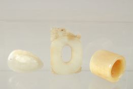 A FINE CHINESE CARVED WHITE JADE PENDANT, together with an archers ring and a carved moth