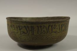 AN UNUSUAL POSSIBLY EARLY ISLAMIC MAMLUK STYLE GREEN LACQUERED BOWL, with Arabic calligraphy, 24cm