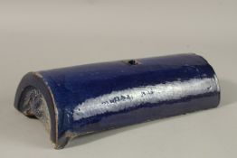 A CHINESE BLUE GLAZED POTTERY ROOF TILE, with carved dragon to the end, together with five glazed