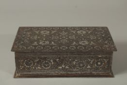 A FINE 19TH CENTURY NORTH INDIAN KOFTGARI SILVER AND GOLD INLAID STEEL BOX, 18cm x 10.5cm.