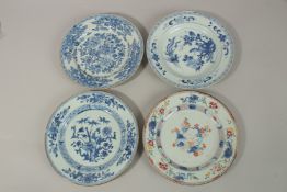 FOUR 19TH CENTURY CHINESE PORCELAIN PLATES, three with blue and white floral designs and one famille