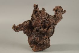 A CHINESE ROOTWOOD NATURALISTIC BRUSH REST, 29cm wide.