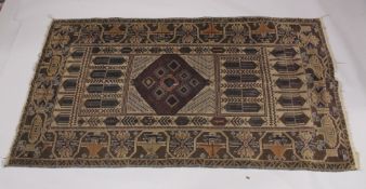 AN AFGHAN OR BELOUCH RUG.