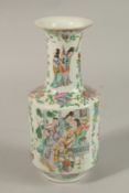 A CHINESE FAMILLE ROSE PORCELAIN VASE, painted with figures, precious objects, and flora, 22.5cm